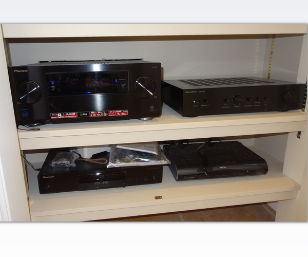 Equipment driving the home cinema system hidden away in a separate cupboard